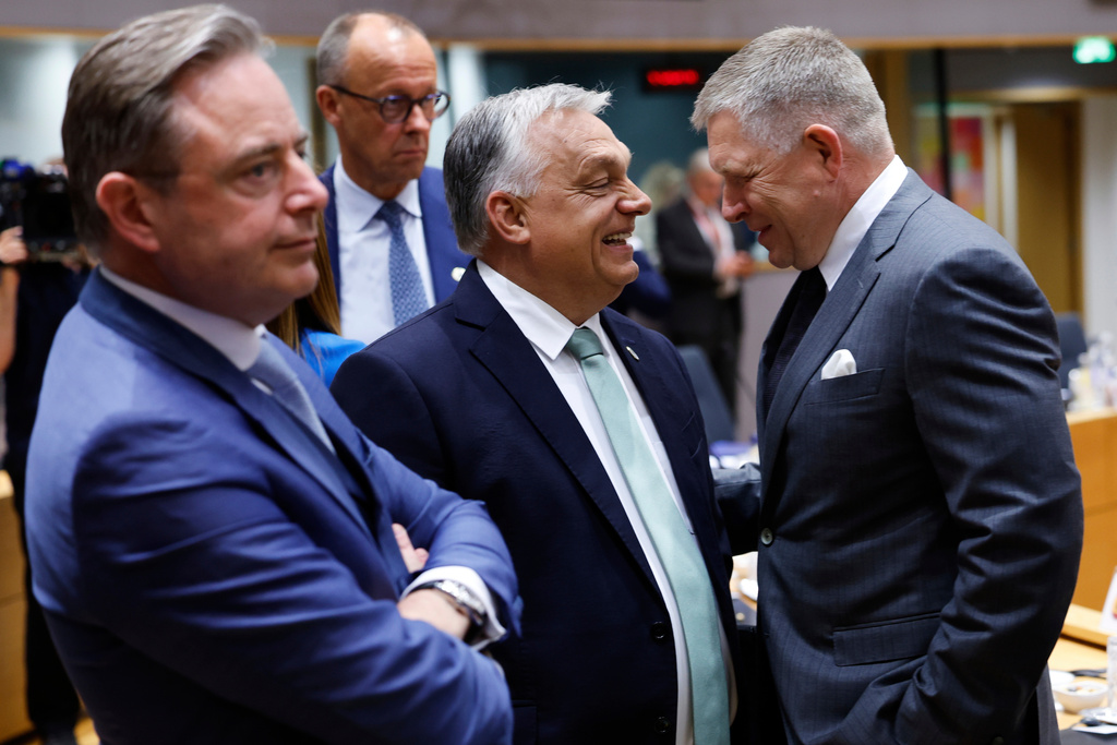 FILE - From left, Belgium's Prime Minister Bart De Wever, Germany's Chancellor Friedrich Merz, Hungary's Prime Minister Viktor Orban and Slovakia's Prime Minister Robert Fico attend a round table meeting at an EU summit in Brussels, Thursday, June 26, 2025. (AP Photo/Geert Vanden Wijngaert, File)