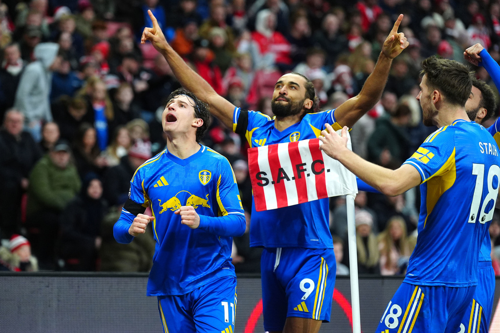Leeds United's Dominic Calvert-Lewin, center, celebrates scoring their side's first goal of the game during the English Premier League soccer match in Sunderland, England, Sunday, Dec. 28, 2025. (Owen Humphreys/PA via AP)