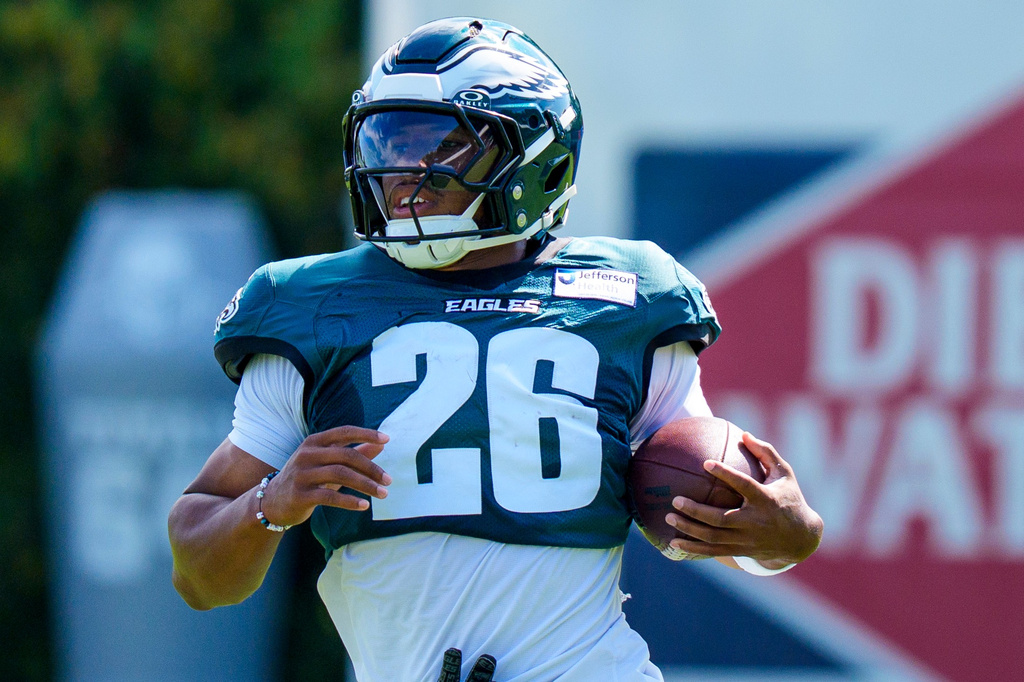 Philadelphia Eagles running back Saquon Barkley (26) runs with the ball during practice at NFL football training camp at the team's training facility in Philadelphia, Tuesday, Aug. 4, 2026. (AP Photo/Chris Szagola)