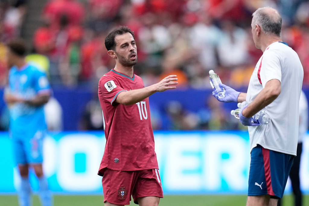 Portugal's Bernardo Silva takes a bottle of water during a hydration break during the World Cup Group K soccer match between Portugal and Congo in Houston, Wednesday, June 17, 2026. (AP Photo/Ashley Landis)