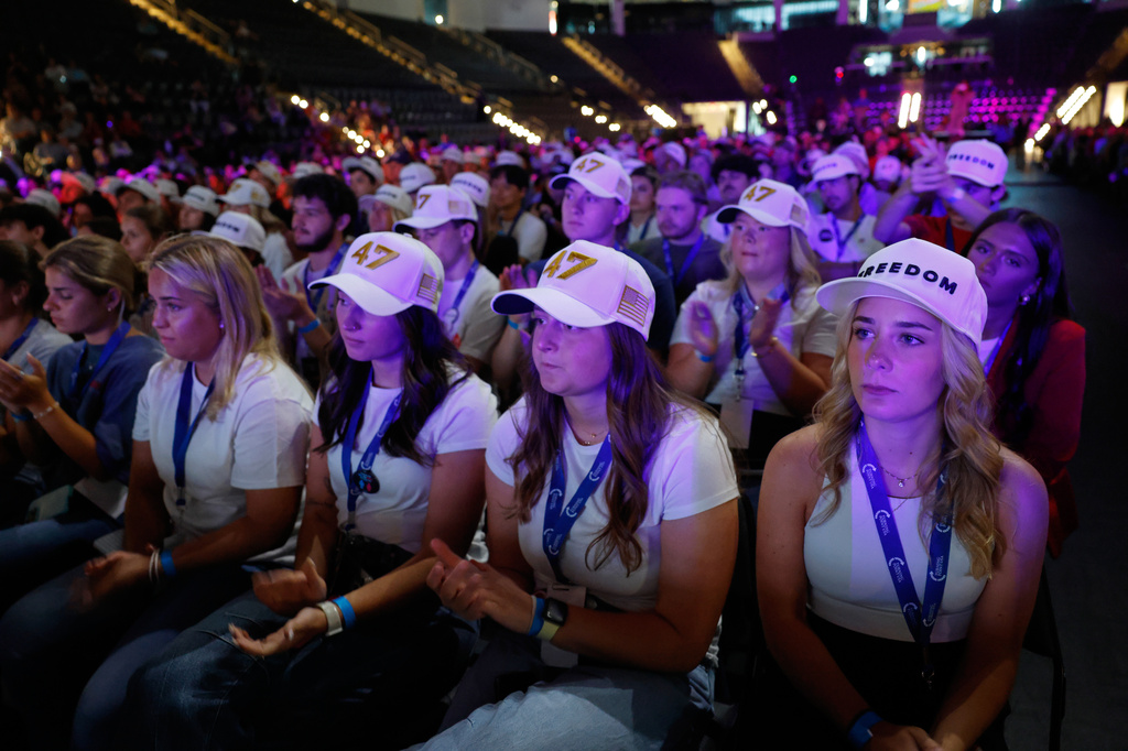 People listen as Vice President JD Vance speaks at a Turning Point USA tour stop at the University of Georgia in Athens, Ga., Tuesday, April 14, 2026. (AP Photo/Erik S. Lesser)