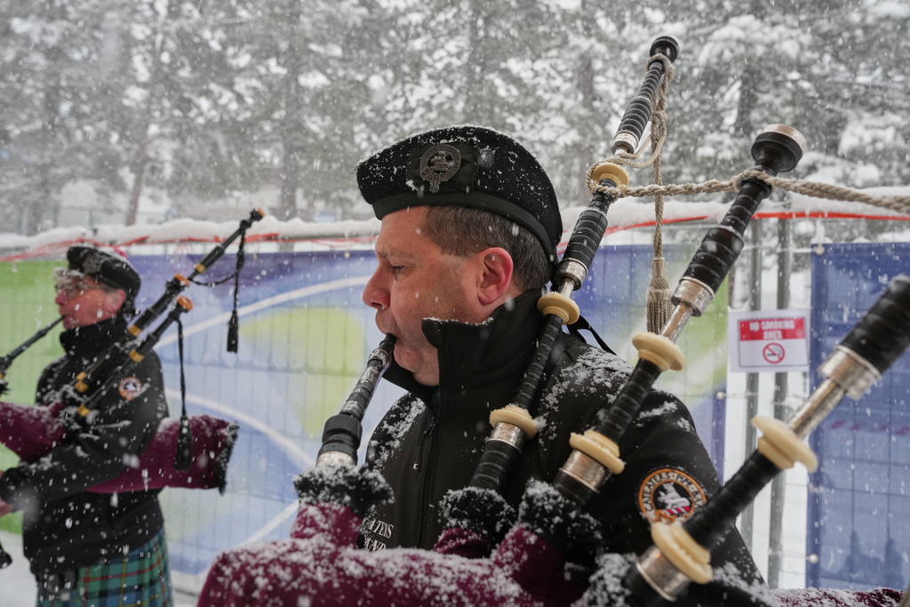 Italian bagpipers practice outside the curling stadium, at the 2026 Winter Olympics, in Cortina d'Ampezzo, Italy, Thursday, Feb. 19, 2026. (AP Photo/Misper Apawu)