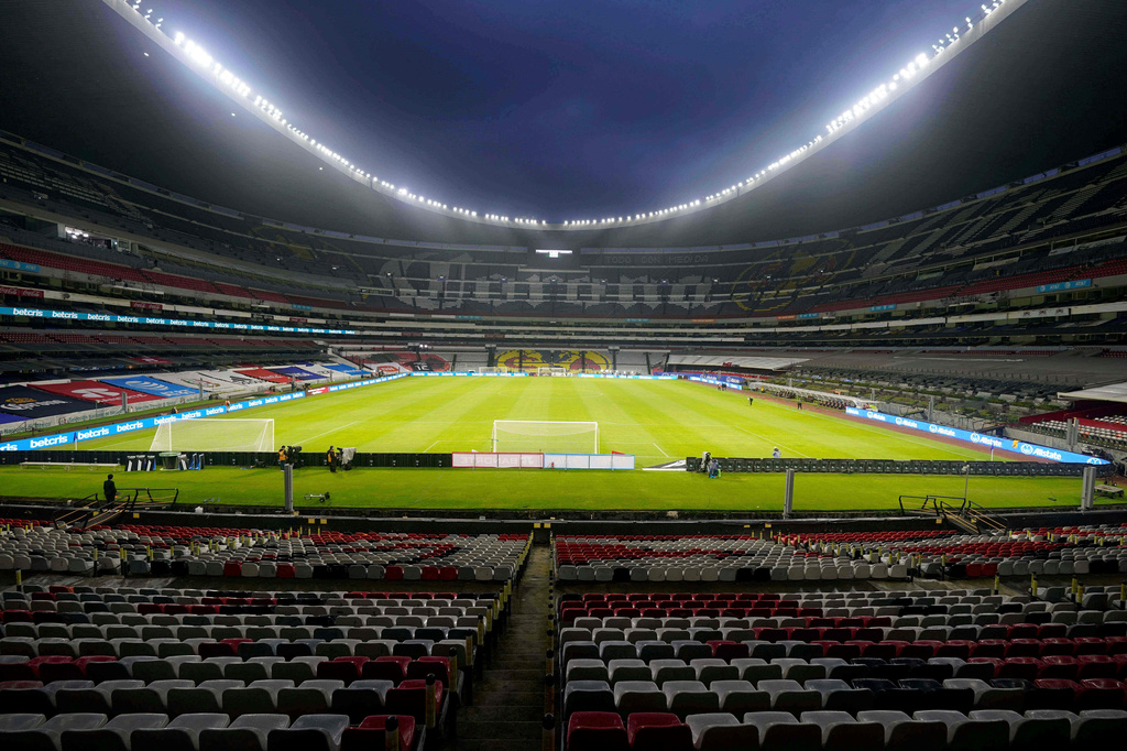 FILE - The stands of the Azteca stadium are seen empty of fans prior a World Cup Qatar 2022 qualifying soccer match between Mexico and Jamaica, in Mexico City, Thursday, Sept. 2, 2021. (AP Photo/Eduardo Verdugo, File)