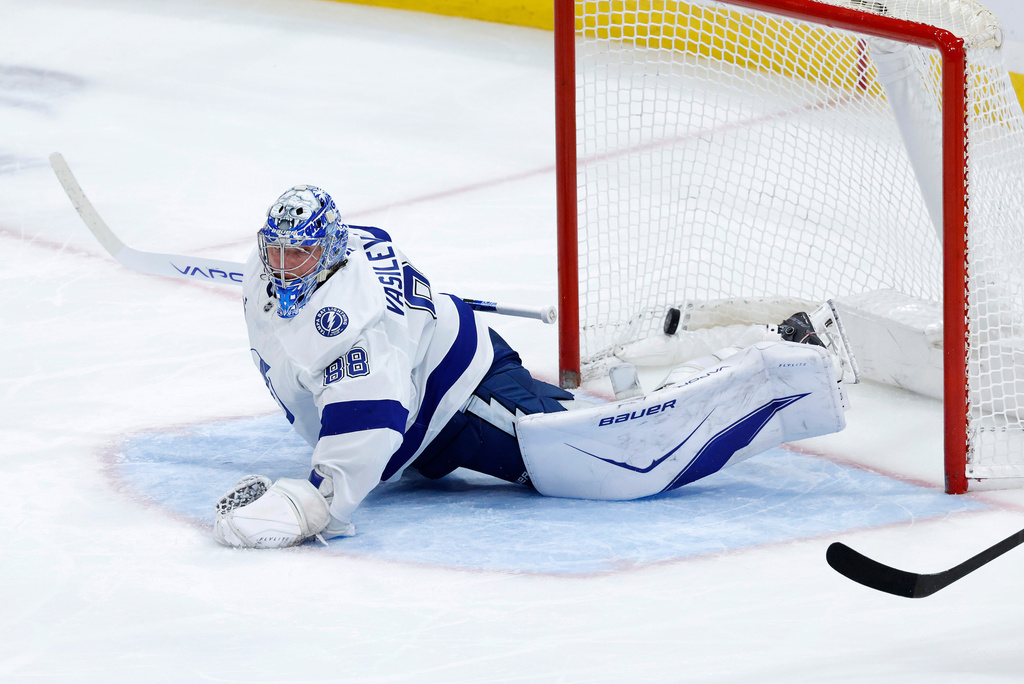 Tampa Bay Lightning goaltender Andrei Vasilevskiy allows a goal by the Florida Panthers during the second period of an NHL hockey game, Saturday, Dec. 27, 2025, in Sunrise, Fla. (AP Photo/Rhona Wise)
