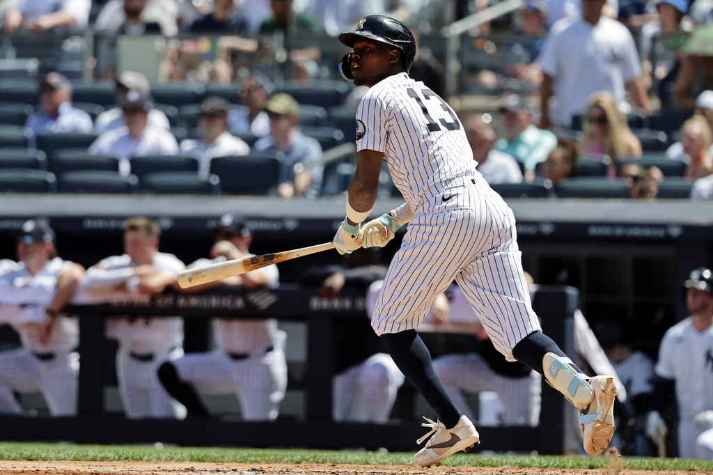 New York Yankees' Jazz Chisholm Jr. watches his sacrifice fly during the fourth inning of a baseball game against the Cleveland Guardians, Thursday, June 4, 2026, in New York. (AP Photo/Adam Hunger)
