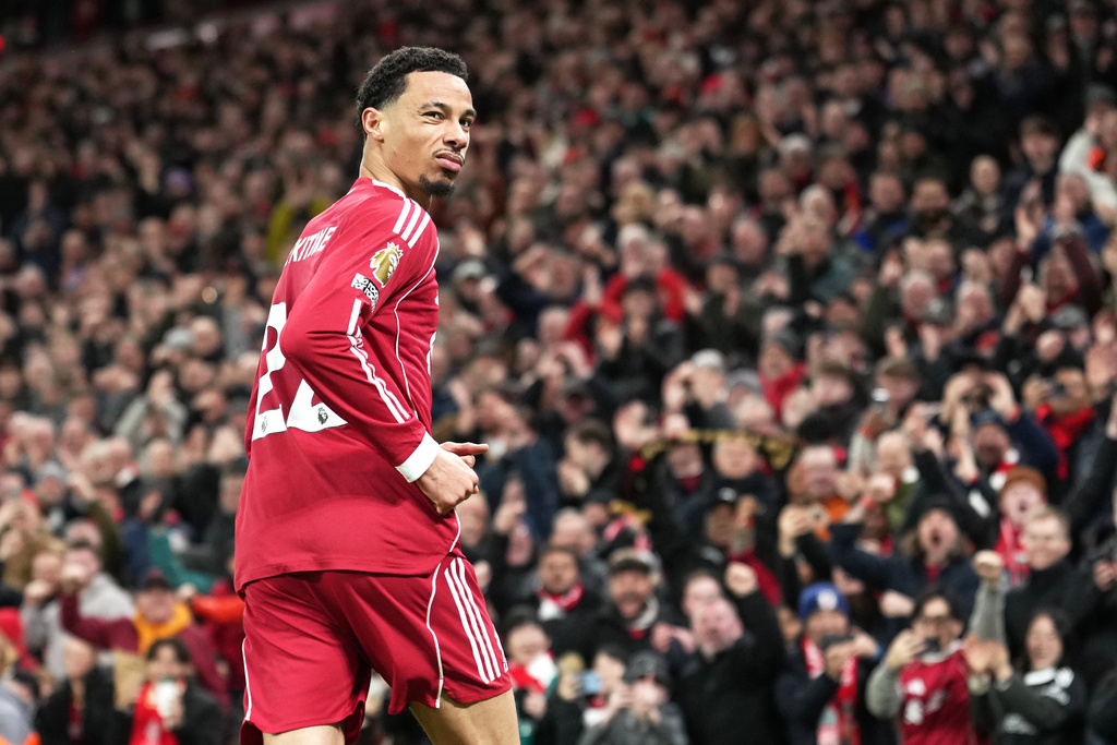 Liverpool's Hugo Ekitike celebrates after scoring his side's second goal during the English Premier League soccer match between Liverpool and Brighton and Hove Albion in Liverpool, England, Saturday, Dec. 13, 2025. (AP Photo/Jon Super)