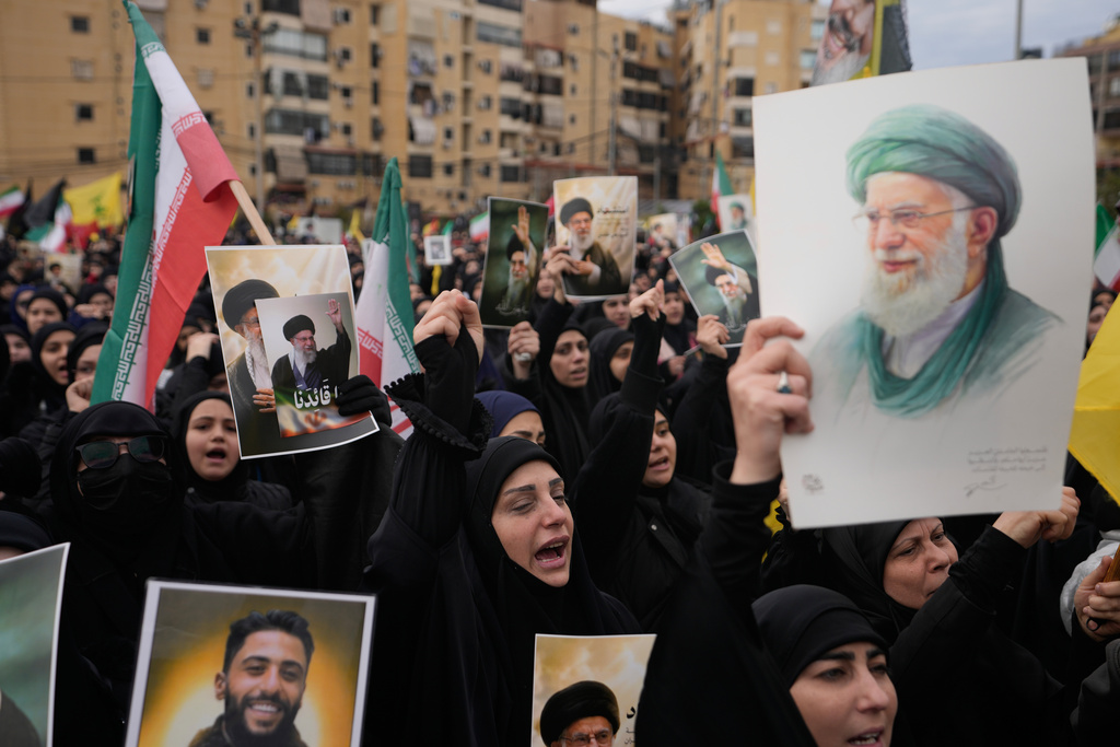 Hezbollah supporters shout slogans as they gather to mourn the death of Iranian Supreme Leader Ayatollah Ali Khamenei in the southern Suburb of Beirut, Lebanon, Sunday, March 1, 2026. (AP Photo/Hassan Ammar)