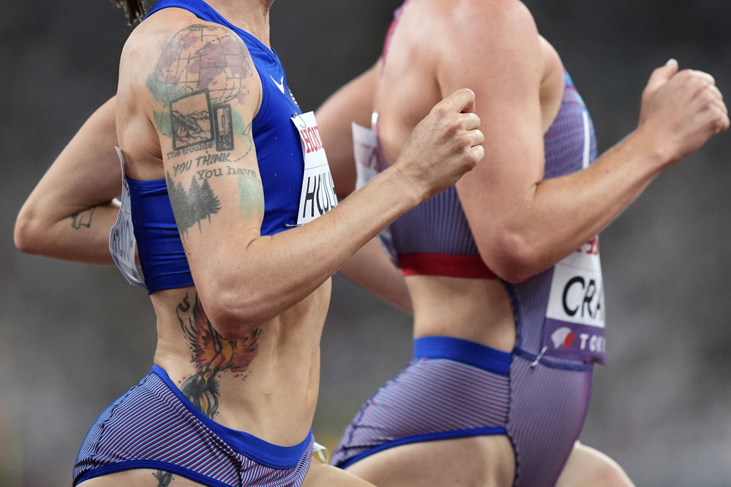 A view of the tattoo on the arm of United States' Shelby Houlihan as she races alongside United States' Elise Cranny in a women's 5,000 meters heat at the World Athletics Championships in Tokyo, Thursday, Sept. 18, 2025. (AP Photo/Petr David Josek)