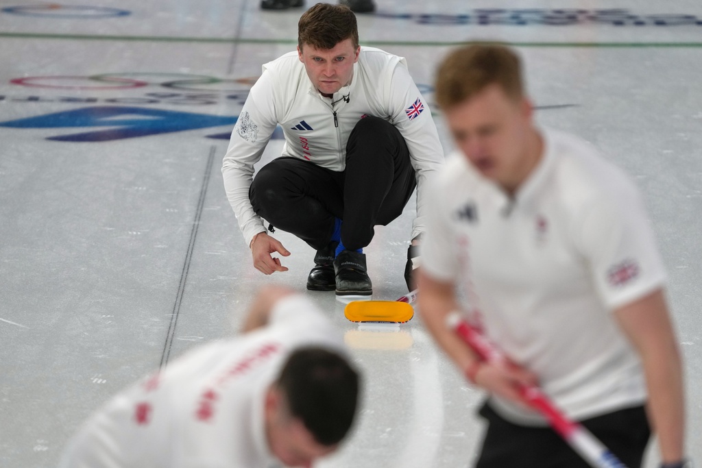 Britain's Bruce Mouat in action during the men's curling round robin session against the United States, at the 2026 Winter Olympics, in Cortina d'Ampezzo, Italy, Wednesday, Feb. 18, 2026. (AP Photo/Misper Apawu)