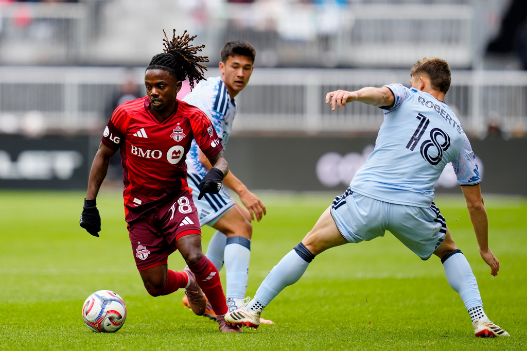 Toronto FC midfielder Malik Henry (78) dribbles past San Jose Earthquakes defender Reid Roberts (18) during the first half of an MLS soccer game in Toronto, Saturday, May 2, 2026. (Frank Gunn/The Canadian Press via AP)