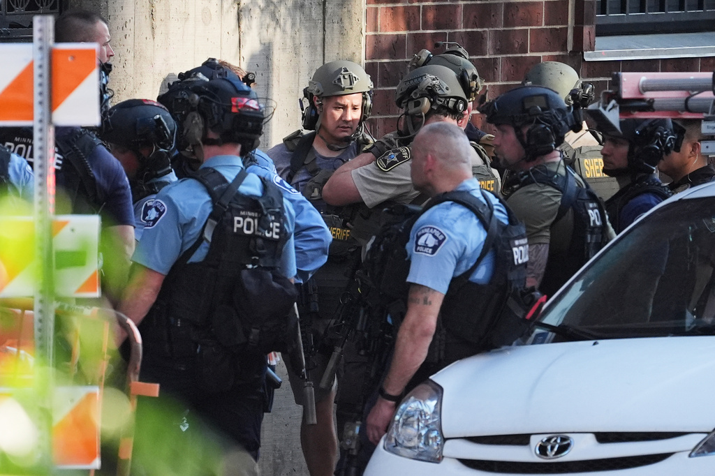 Law enforcement respond to a shooting Wednesday, Sept. 2, 2026, in downtown Minneapolis. (AP Photo/Ellen Schmidt)