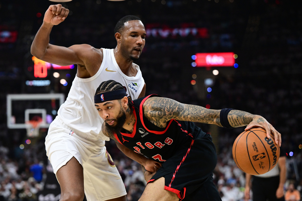 Toronto Raptors forward Brandon Ingram drives on Cleveland Cavaliers center Evan Mobley during the first half in Game 5 of a first-round NBA playoffs basketball series, Wednesday, April 29, 2026, In Cleveland. (AP Photo/David Dermer)