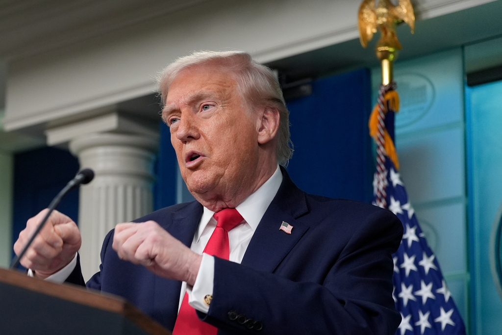 President Donald Trump gestures while he speaks in the James Brady Press Briefing Room at the White House, Tuesday, Jan. 20, 2026, in Washington. (AP Photo/Alex Brandon)