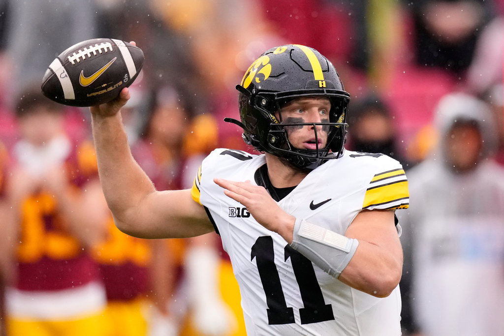 Iowa quarterback Mark Gronowski passes during the first half of an NCAA college football game against Southern California, Saturday, Nov. 15, 2025, in Los Angeles. (AP Photo/Mark J. Terrill)