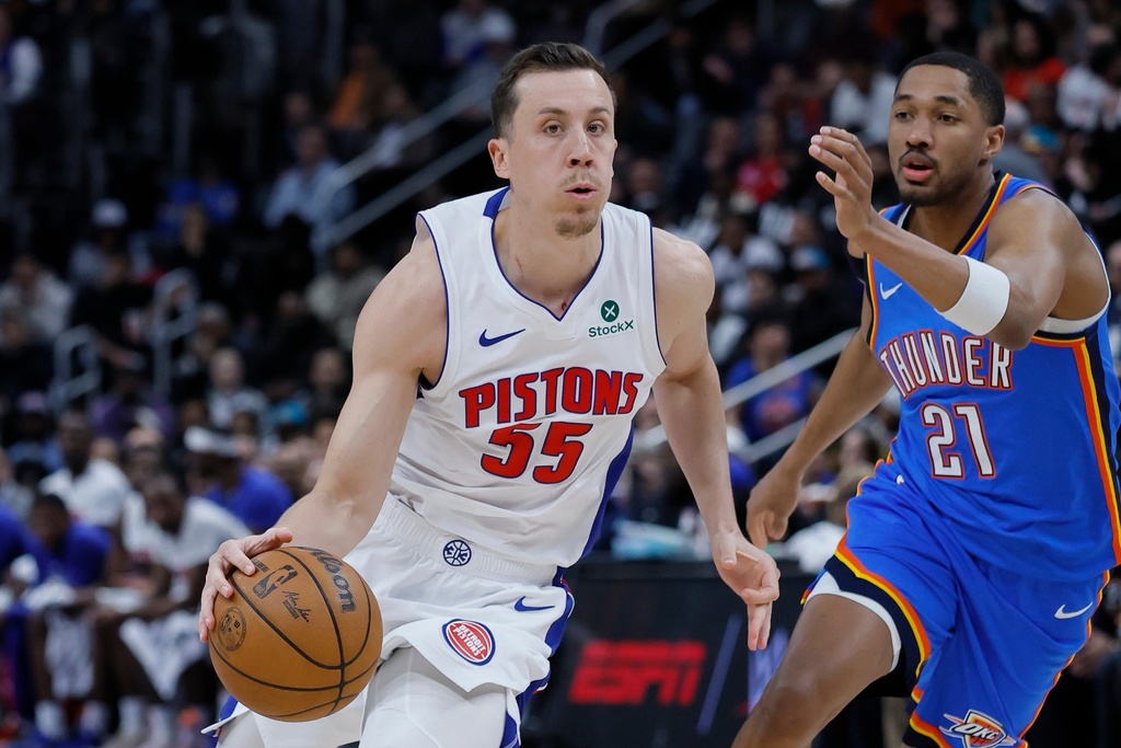 Detroit Pistons forward Duncan Robinson (55) drives against Oklahoma City Thunder guard Aaron Wiggins (21) during the first half of an NBA basketball game, Wednesday, Feb. 25, 2026, in Detroit. (AP Photo/Duane Burleson)