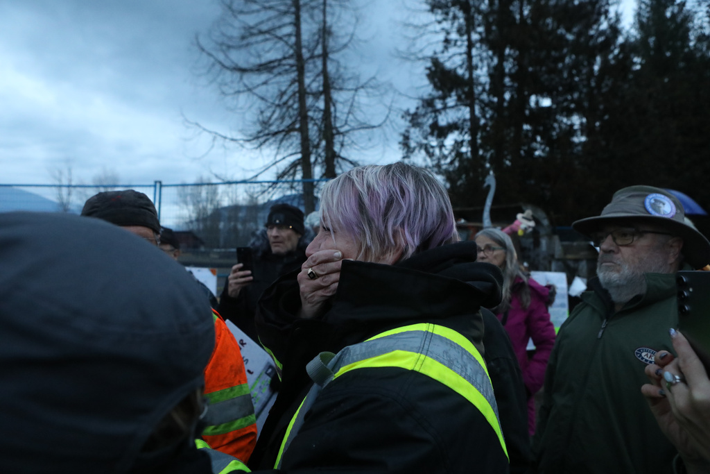 A supporter of Universal Ostrich Farms in Edgewood, B.C., reacts to the announcement of the Supreme Court of Canada's decision to dismiss an appeal by the farm to stay an order to cull more than 300 of its ostriches on Thursday, Nov. 6, 2025. (Aaron Hemens /The Canadian Press via AP)