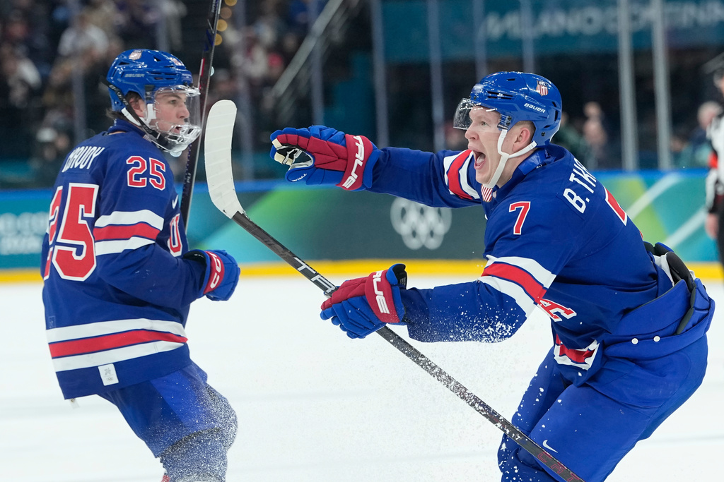 United States' Brady Tkachuk, right, celebrates after scoring his side's second goal during a preliminary round match of men's ice hockey between United States and Denmark at the 2026 Winter Olympics, in Milan, Italy, Saturday, Feb. 14, 2026. (AP Photo/Petr David Josek)