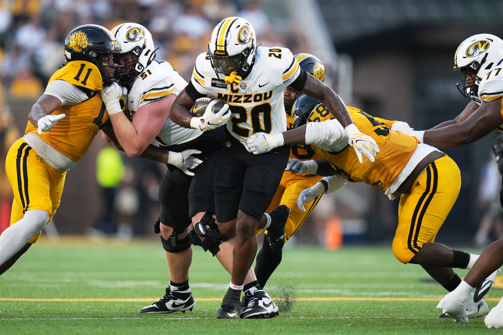 Missouri running back Jamal Roberts (20) runs with the ball during the first half of an NCAA college football game against Arkansas-Pine Bluff Thursday, Sept. 3, 2026, in Columbia, Mo. (AP Photo/Jeff Roberson)
