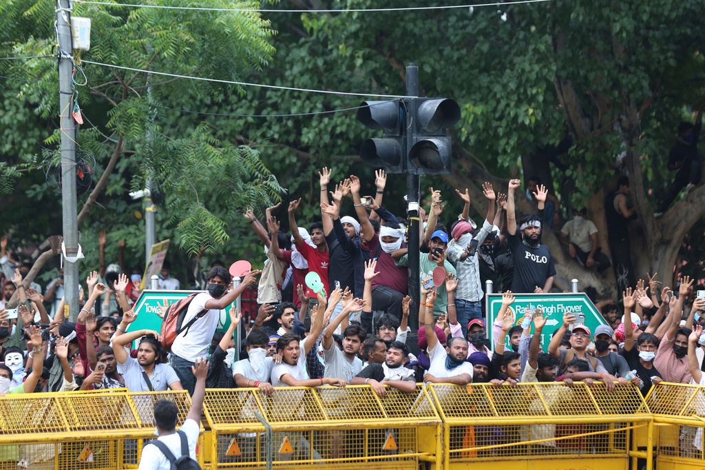 Protesters react after India's Education Minister Dharmendra Pradhan resigned following nationwide protests as part of the Cockroach Janta Party's protest movement in New Delhi, India, Saturday, July 25, 2026. (AP Photo/Vipin)