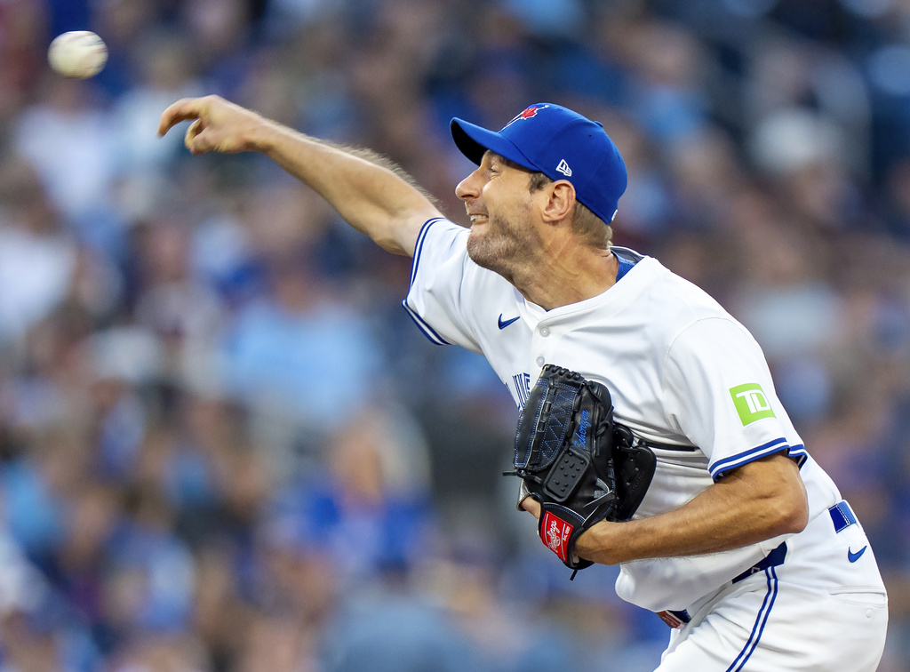 Toronto Blue Jays starting pitcher Max Scherzer throws in first-inning baseball game action against the Minnesota Twins in Toronto, Monday, Aug. 25, 2025. (Frank Gunn/The Canadian Press via AP)