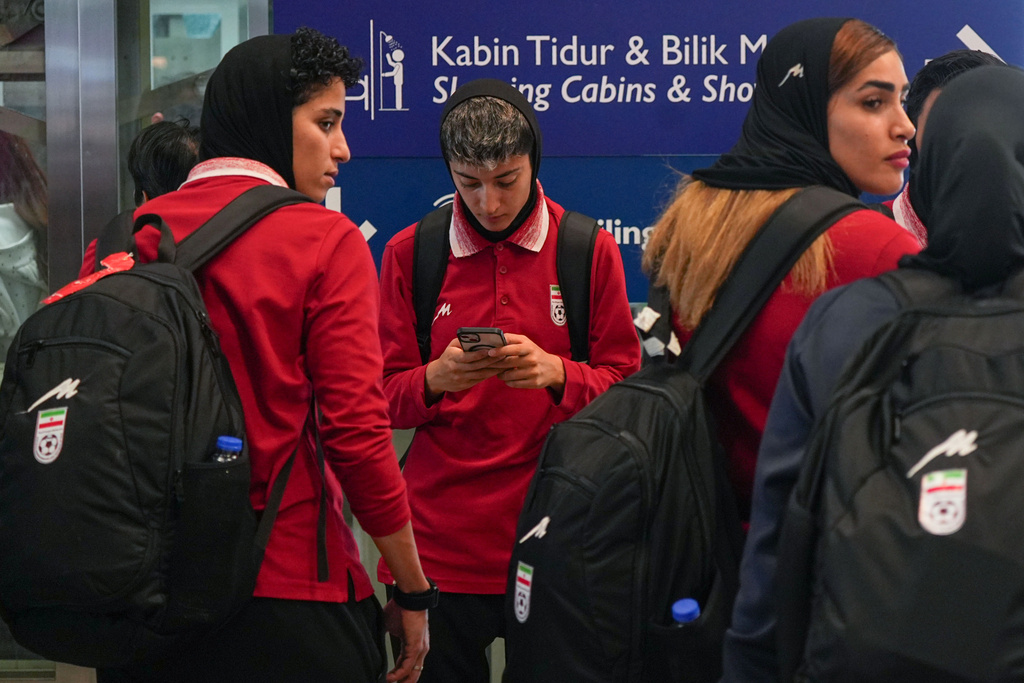 Members of Iran's women's football team arrive at the Kuala Lumpur International Airport in Sepang, Malaysia, Monday, March 16, 2026. (AP Photo/Azneal Ishak)