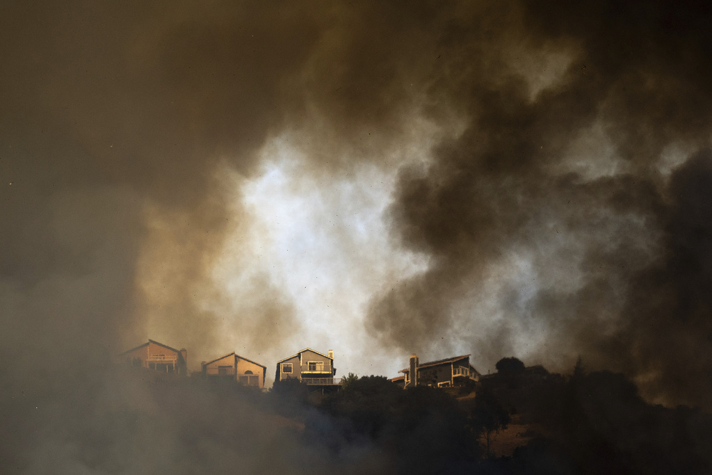 A fastmoving brush fire in California burned 2 homes while others were
