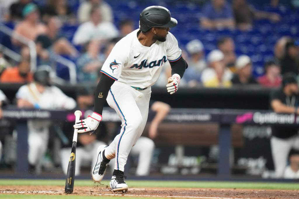 Miami Marlins' Otto Lopez runs after hitting a triple to break a franchise record with the most hits before the All Star break during the fourth inning of a baseball game against the Seattle Mariners, Thursday, July 9, 2026, in Miami. (AP Photo/Lynne Sladky)