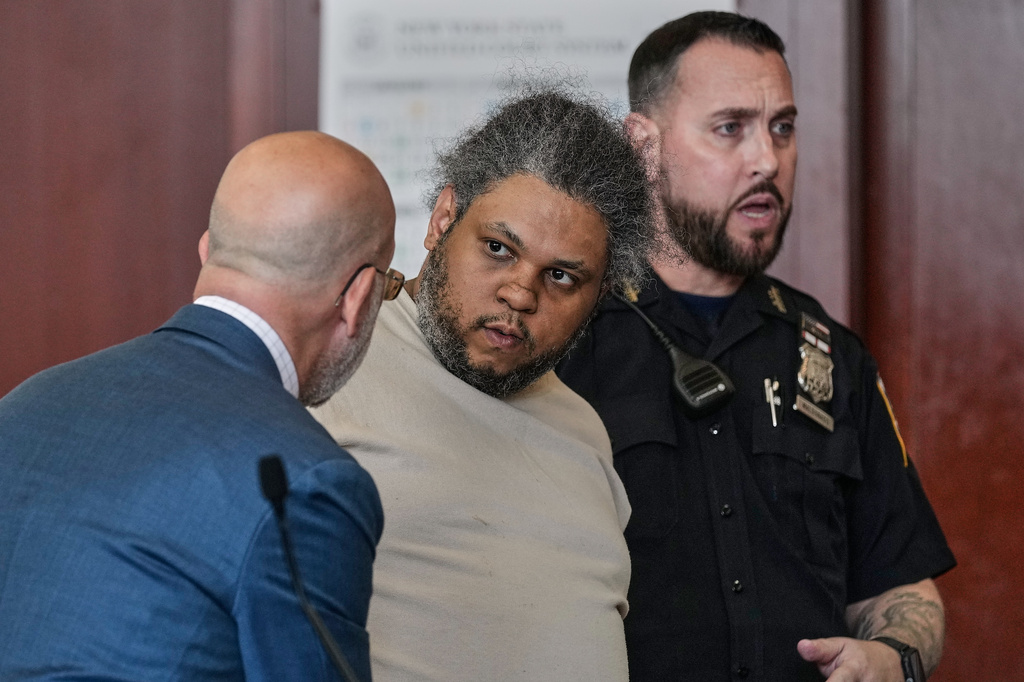 Randy Santos, right, listens to his attorney Arnold Levine in court after he was sentenced for fatally beating four sleeping men on the streets in 2019, in New York, Thursday, May 28, 2026. (AP Photo/Richard Drew)
