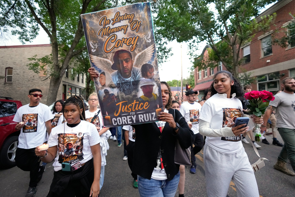 Protesters march Thursday, July 23, 2026, in Madison, Wis., after a Madison police officer shot and killed Corey Durell Ruiz on Wednesday. (AP Photo/Kayla Wolf)