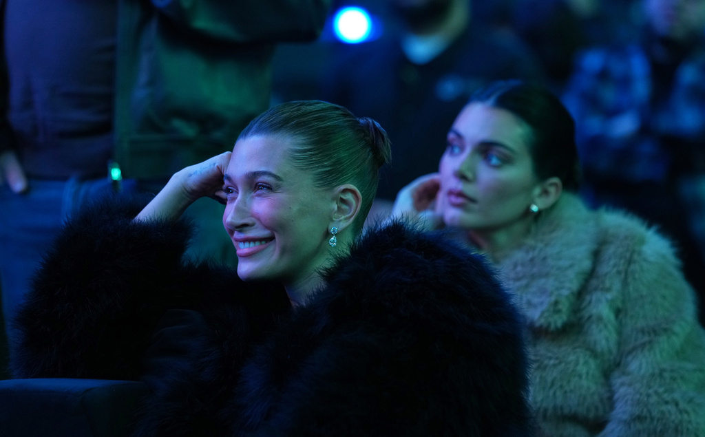 Haylie Bieber, left, and Kendall Jenner watch stage remarks at the launch party for Fanatics Studio, a global studio for sports entertainment, on Tuesday, Jan. 13, 2026, at the Intuit Dome in Inglewood, Calif. (AP Photo/Chris Pizzello)