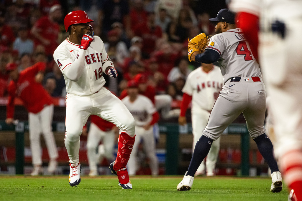 A fight breaks out during the fifth inning of a baseball game between the Los Angeles Angels and the Atlanta Braves, Tuesday, April 7, 2026, in Anaheim, Calif. (AP Photo/Ethan Swope)