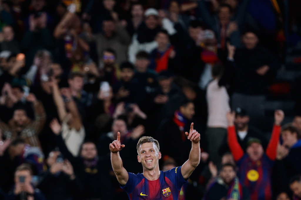 Barcelona's Dani Olmo celebrates after scoring his side's third goal during a Spanish La Liga soccer match between Barcelona and Alaves, in Barcelona, Spain, Saturday, Nov. 29, 2025. (AP Photo/Joan Monfort)