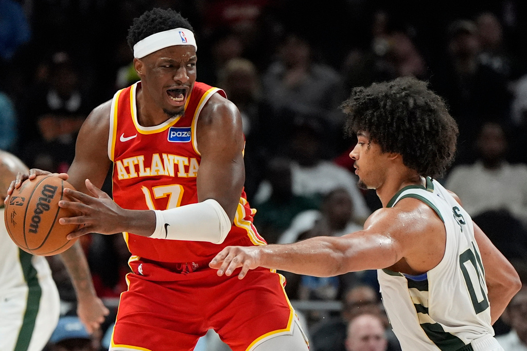 Atlanta Hawks forward Onyeka Okongwu (17) drives against Milwaukee Bucks center Jericho Sims (00) during the second half of an NBA basketball game, Saturday, March 14, 2026, in Atlanta. (AP Photo/Mike Stewart)