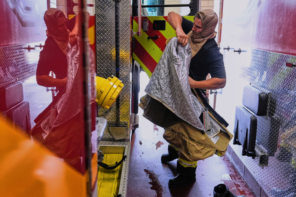 Firefighter Brendan Dyer suits up in recently issued non-PFAS turnout gear at Fire Station 4 in East Providence, R.I., on July 3, 2025. (AP Photo/Charles Krupa)