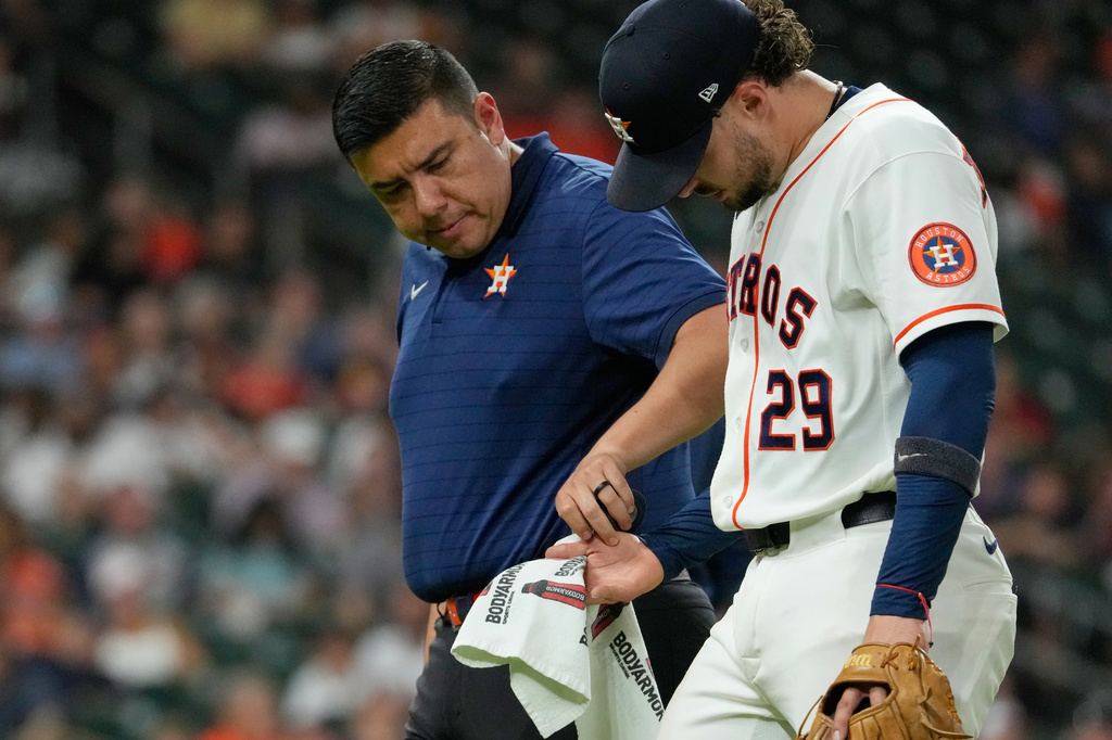 Houston Astros shortstop Raynel Delgado (29) leaves the game after trying to field a single by Minnesota Twins' Trevor Larnach during the fifth inning of a baseball game Wednesday, July 1, 2026, in Houston. (AP Photo/David J. Phillip)