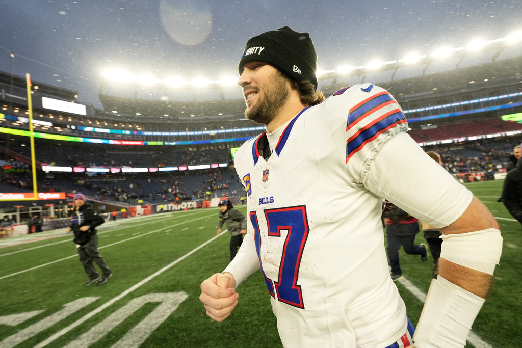 Buffalo Bills quarterback Josh Allen jogs off the field after an NFL football game against the New England Patriots in Foxborough, Mass., Sunday, Dec. 14, 2025. (AP Photo/Robert F. Bukaty)