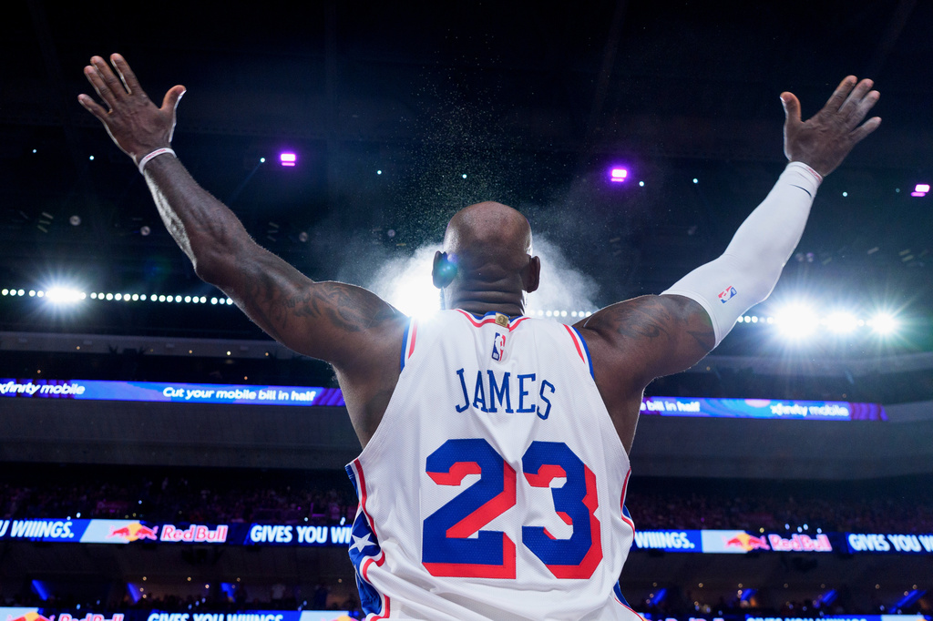 Philadelphia 76ers' LeBron James tosses the chalk in the air ahead of the first half of an NBA basketball game against the Detroit Pistons, Sunday, Oct. 25, 2026, in Philadelphia. (AP Photo/Chris Szagola)