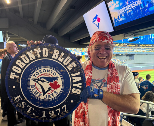 Toronto Blue Jays fan Geoffrey Fulton poses with his Blue Jays gear and maple leaf bandana during Game 7 of baseball's American League Championship Series between the Blue Jays and Seattle Mariners in Toronto, Monday, Oct. 20, 2025. (AP Photo/Rob Gillies) Toronto Blue Jays fan Geoffrey Fulton poses with his Blue Jays gear and maple leaf bandana during Game 7 of baseball's American League Championship Series between the Blue Jays and Seattle Mariners in Toronto, Monday, Oct. 20, 2025. (AP Photo/Rob Gillies)