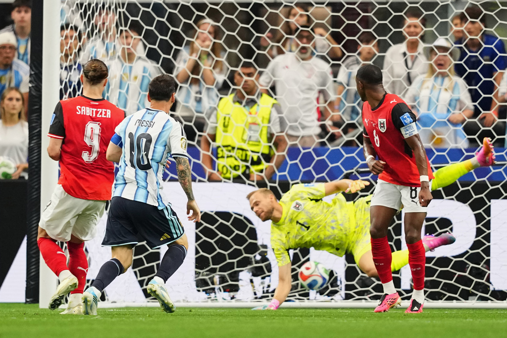 Argentina's Lionel Messi, center, scores the opening goal during the World Cup Group J soccer match between Argentina and Austria in Arlington, Texas, near Dallas, Monday, June 22, 2026. (AP Photo/Julio Cortez)