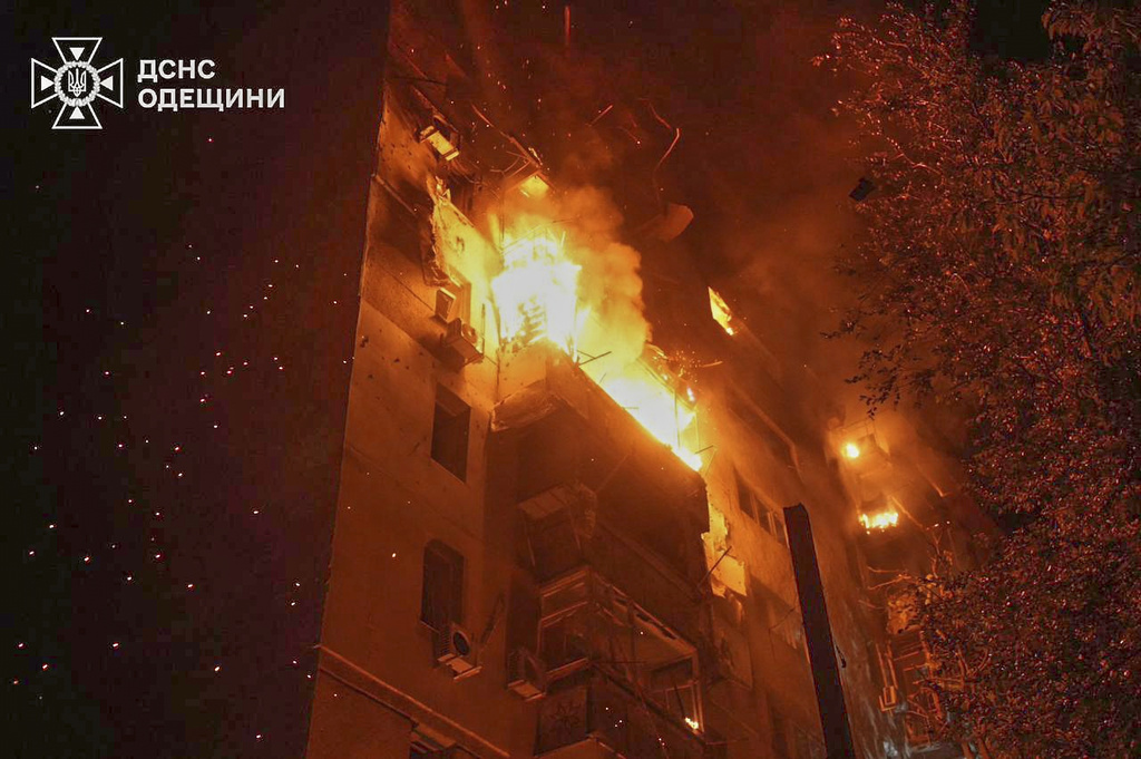 In this photo provided by the Ukrainian Emergency Service, a residential building burns following a Russian air attack in Odesa, Ukraine, Saturday, July 19, 2025. (Ukrainian Emergency Service via AP)
