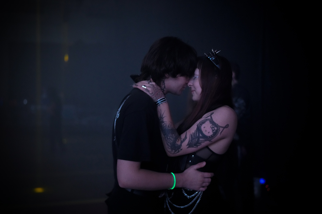 A couple slow dance during a Halloween rave in Kyiv, Ukraine, Saturday, Oct. 25, 2025. (AP Photo/Julia Demaree Nikhinson)