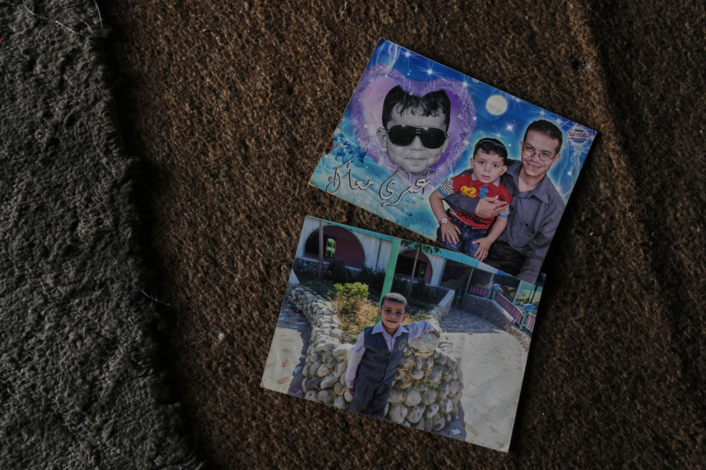 Photos of the father and brother of Razan Sharif Hamdi Shanan, 10, the sole survivor of an Israeli airstrike that killed her parents and siblings, are displayed at the home where she is staying with relatives in Gaza City, Monday, Jan. 19, 2026. (AP Photo/Jehad Alshrafi)