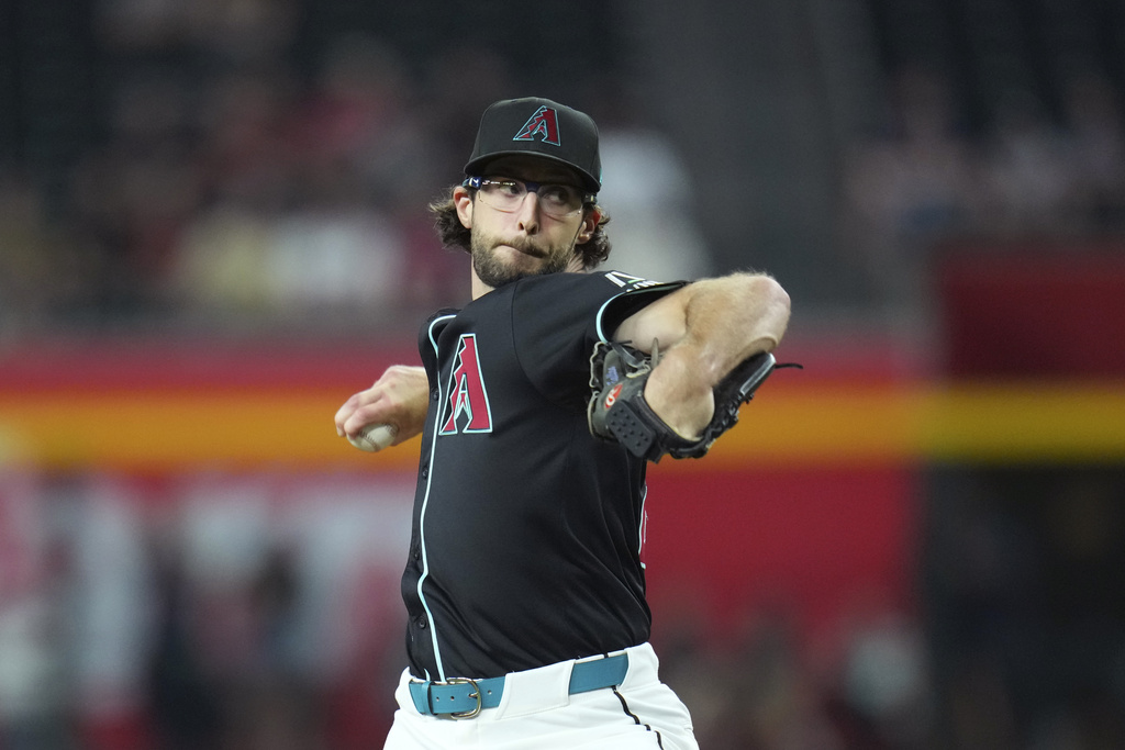 Arizona Diamondbacks starting pitcher Zac Gallen throws against the Cleveland Guardians during the first inning of a baseball game Monday, Aug. 18, 2025, in Phoenix. (AP Photo/Ross D. Franklin)