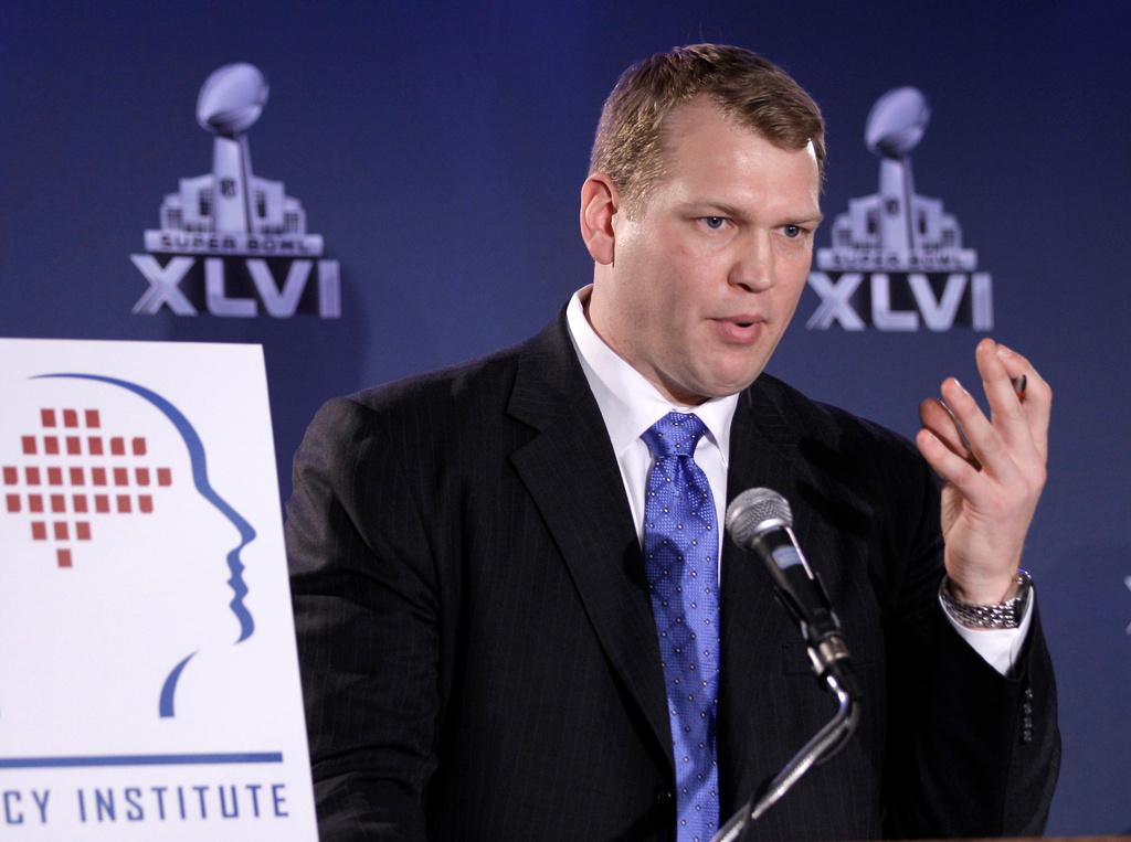 FILE - In this Feb. 3, 2012, file photo, Chris Nowinski, head of the Sports Legacy Institute in Boston, talks about a hit count proposal to dramatically reduce youth athletes' exposure to repetitive brain trauma in multiple sports during a news conference at the Super Bowl XLVI media center in Indianapolis. (AP Photo/David J. Phillip, File)