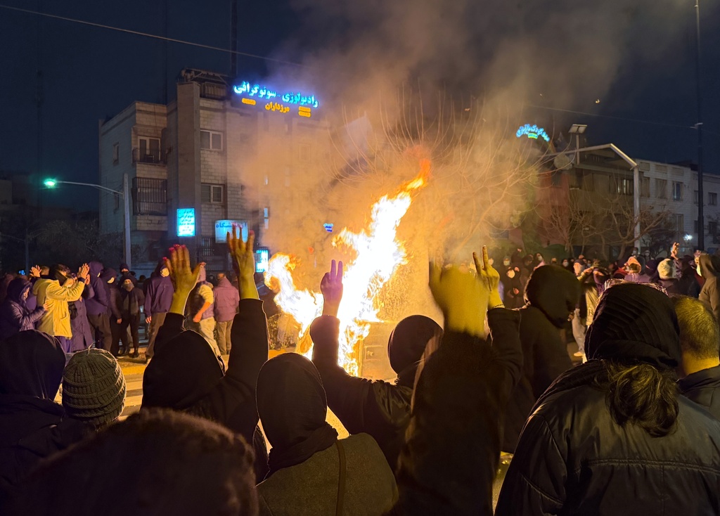 In this photo obtained by The Associated Press, Iranians attend an anti-government protest in Tehran, Iran, Friday, Jan. 9, 2026. (UGC via AP)