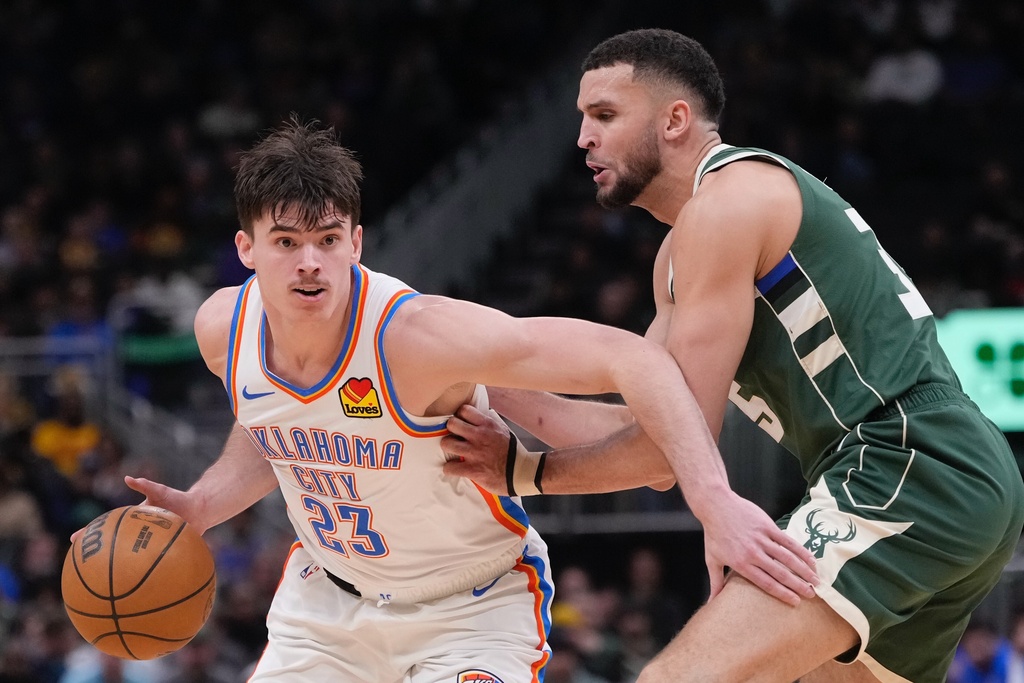 Oklahoma City Thunder's Brooks Barnhizer tries to get past Milwaukee Bucks' Pete Nance during the first half of an NBA basketball game Wednesday, Jan. 21, 2026, in Milwaukee. (AP Photo/Morry Gash)