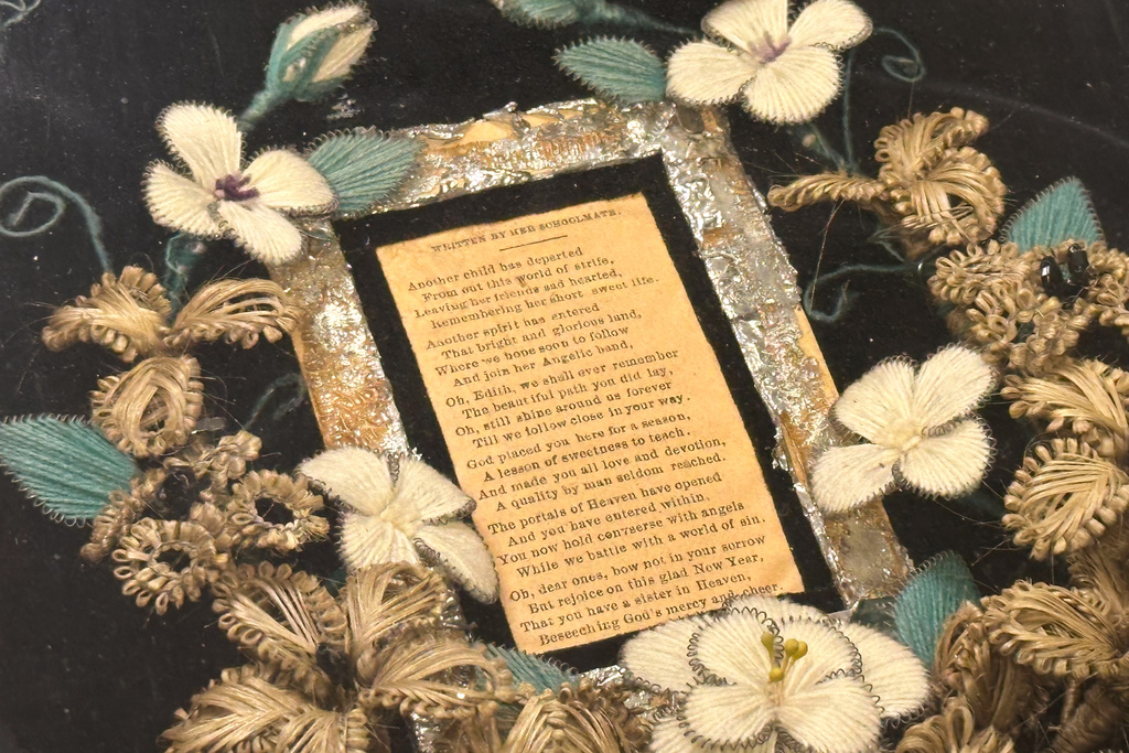 A wreath of human hair encircling a poem about a young girl who died is on display Monday, Oct. 6, 2025, at Leila’s Hair Museum in Independence, Miss. (AP Photo/Nick Ingram)