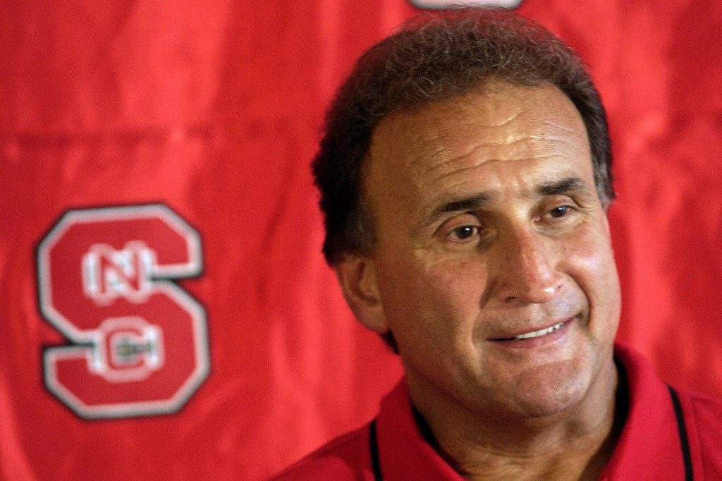 FILE - North Carolina State coach Chuck Amato answers questions from reporters during the team's media day, Aug. 12, 2001, at Carter-Finley Stadium in Raleigh, N.C. (AP Photo/Grant Halverson, File)