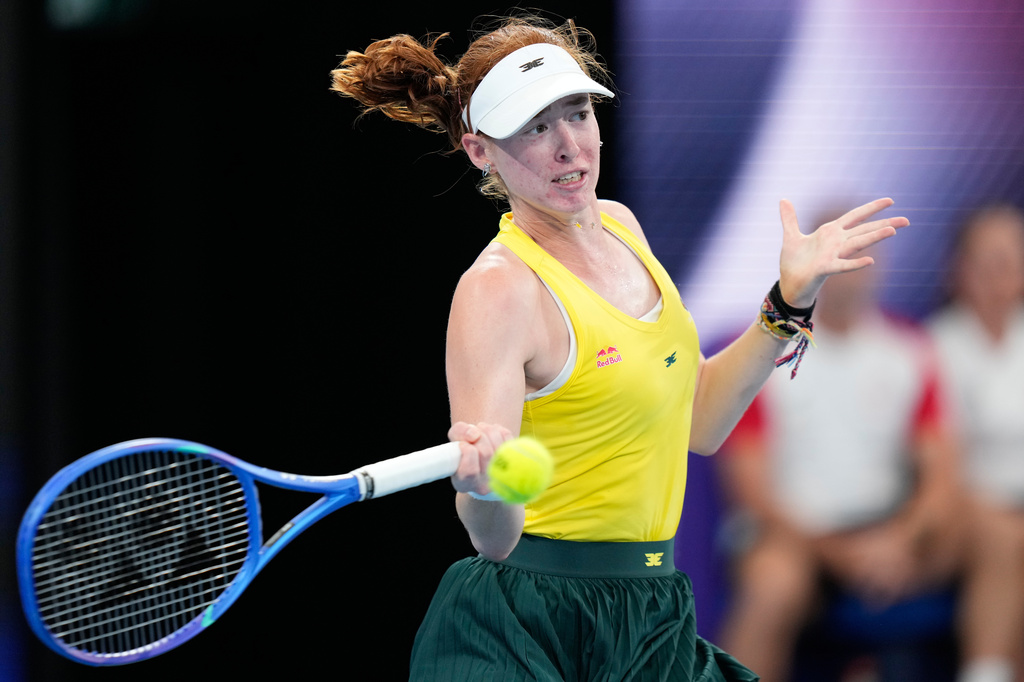 FILE - Maya Joint of Australia hits a forehand to Iga Swiatek of Poland during their quarterfinal match at the United Cup tennis tournament in Sydney, Friday, Jan. 9, 2026. (AP Photo/Rick Rycroft, File)
