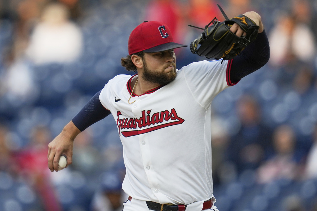 Cleveland Guardians' Slade Cecconi pitches in the first inning of a baseball game against the Kansas City Royals in Cleveland, Monday, Sept. 8, 2025. (AP Photo/Sue Ogrocki)